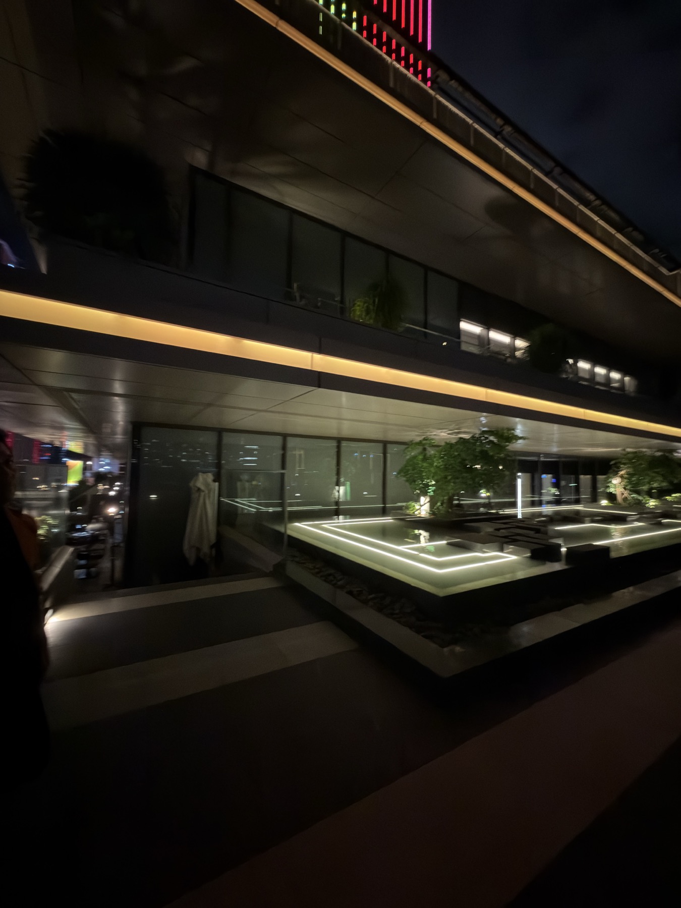 Stepped landscaped terrace architecture at night
